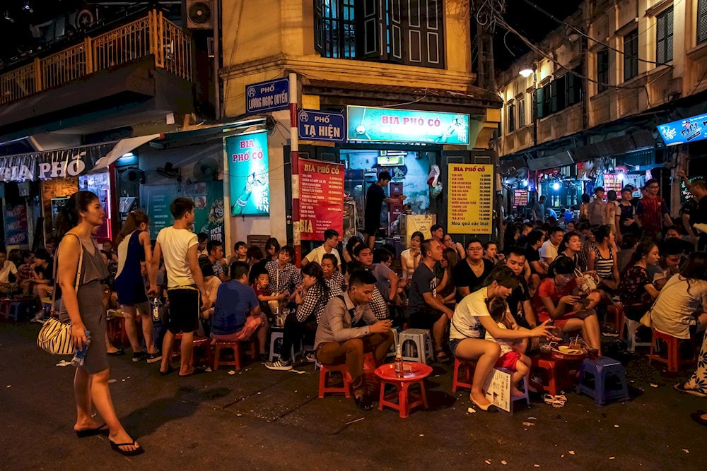 The mix of Vietnamese youth, expats, and travelers creates a dynamic and friendly crowd